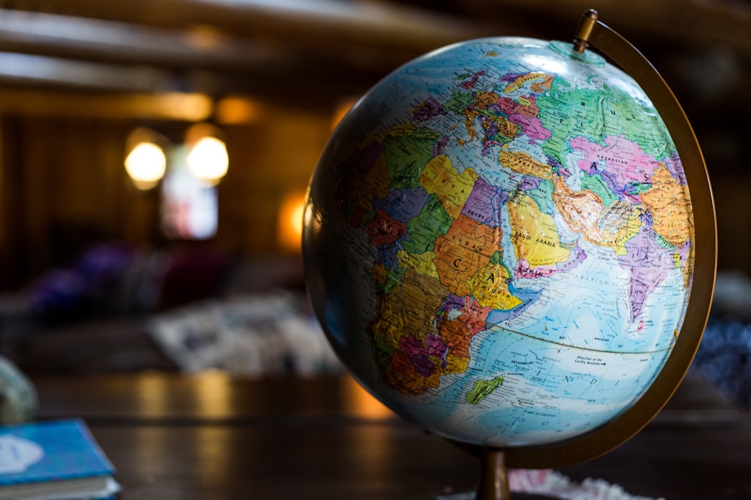 A close-up view of a globe highlighting different countries and continents.